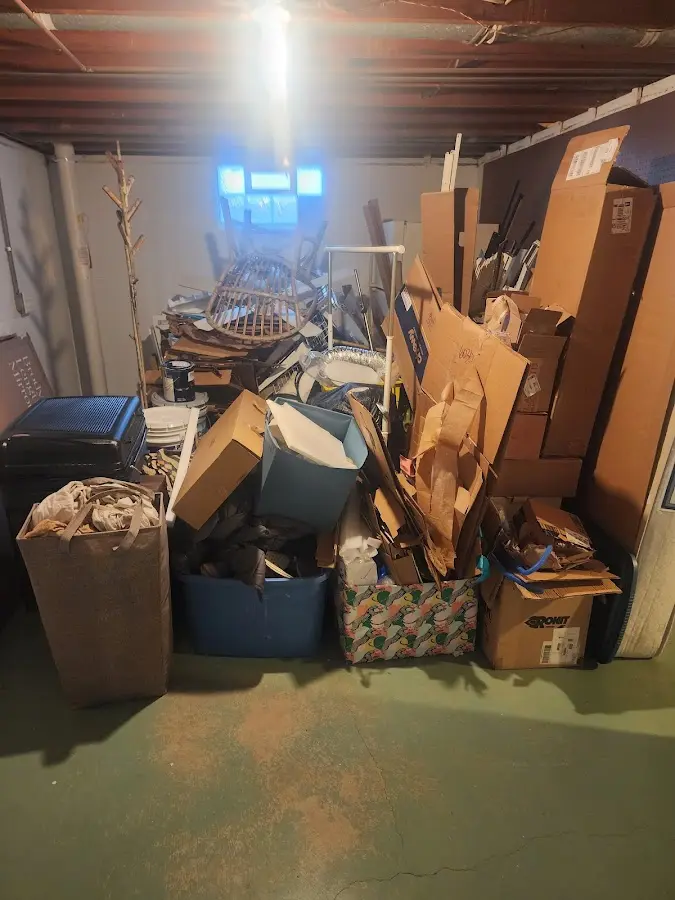 Roll-off dumpster container at job site for 20 Yard Dumpster Rental in Three Lakes